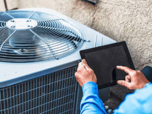 SEO Guide for HVAC Companies - Service man in front of AC -